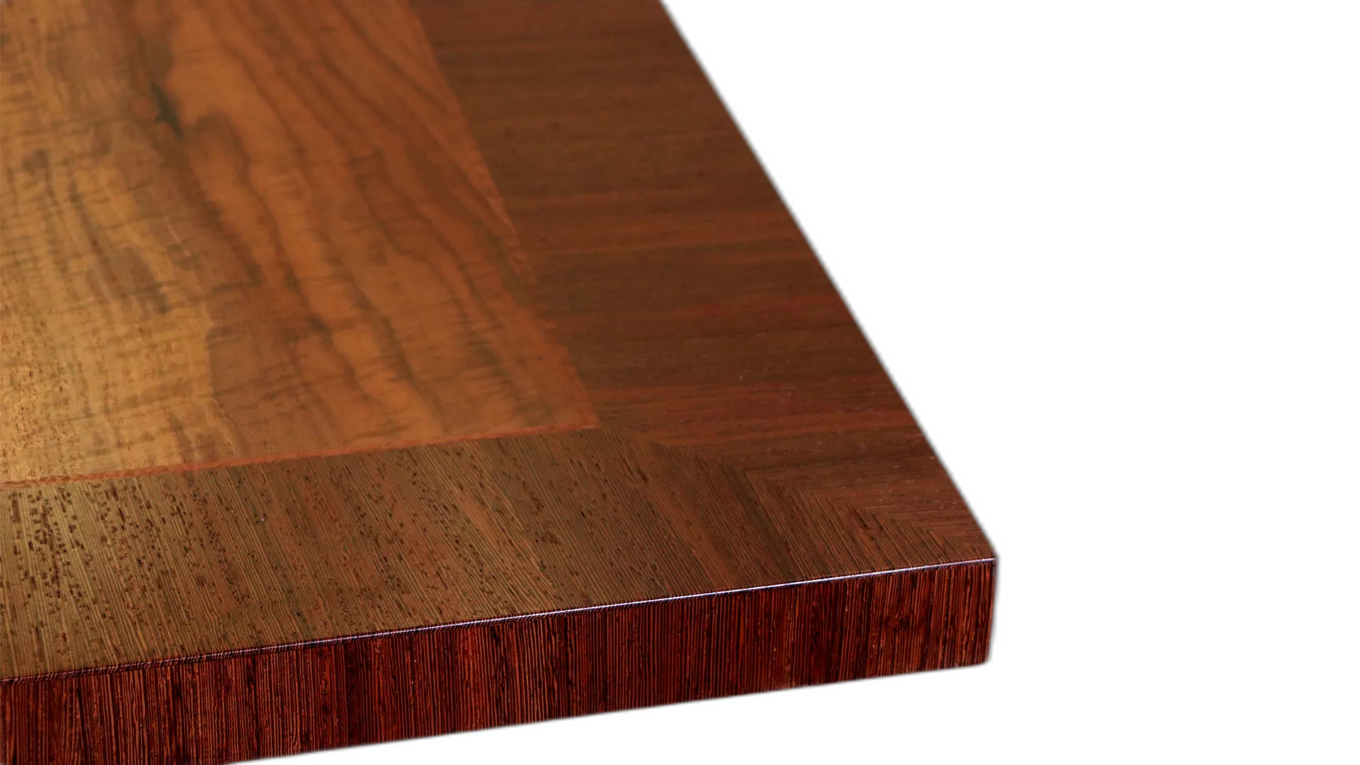 Corner of a walnut dining table top with wenge frieze